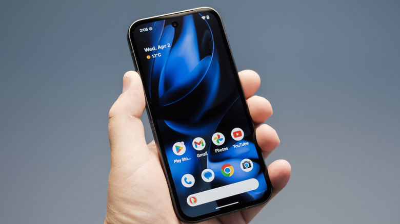 Person holding a Google Pixel 9a