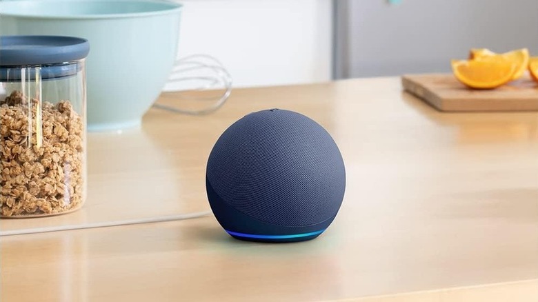 An Amazon Echo Dot smart speaker on a kitchen counter