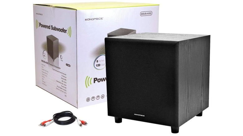 A promotional photo of the Monoprice 60-Watt 8-inch Subwoofer and its packaging, the image also shows two RCA cables