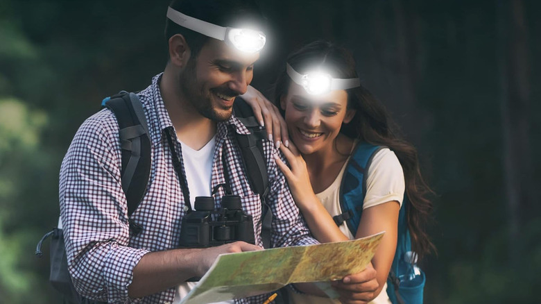 Wearing the Energizer LED Headlamp Pro while looking at a trail map