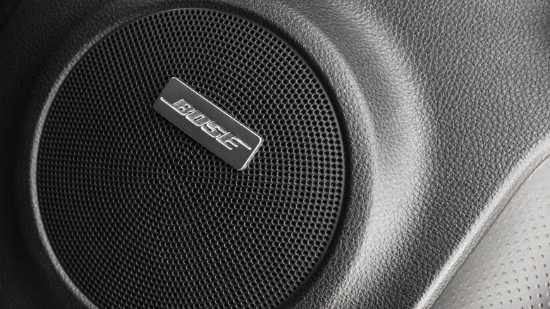 The Bose logo on a car door speaker.