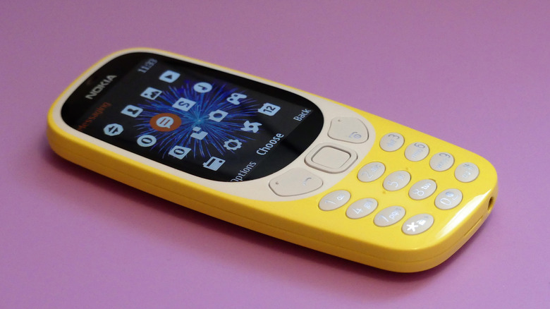 A yellow Nokia candy bar style phone