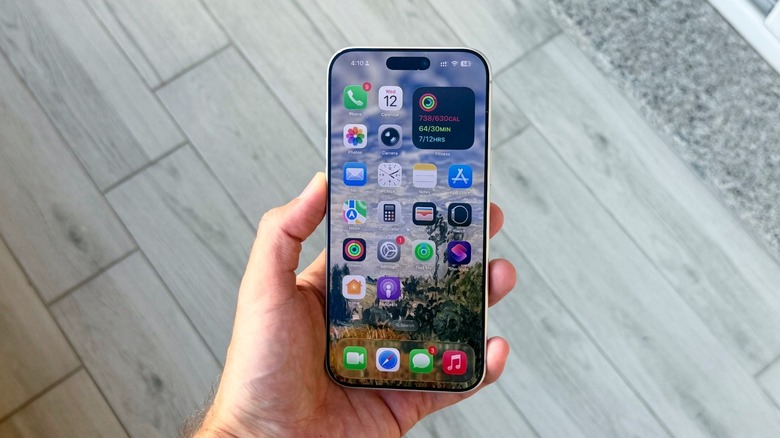 A hand holding an iPhone
