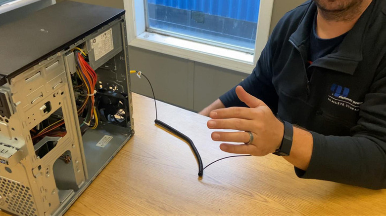 Person using an anti-static wrist strap.