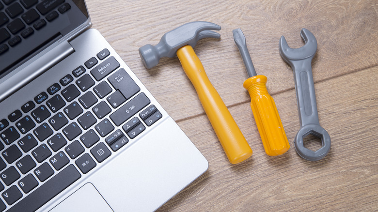 Tools kept near a laptop