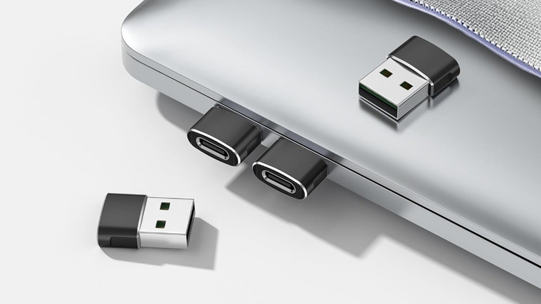 A laptop with Elebase USB-C to USB-A adapters