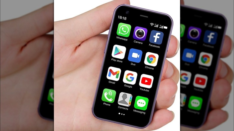 Hand holding a powered-on Cutwif XS15 Mini Smartphone.