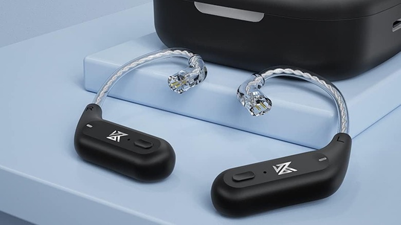 The KZ AZ09 IEM Bluetooth adapters sitting on a table