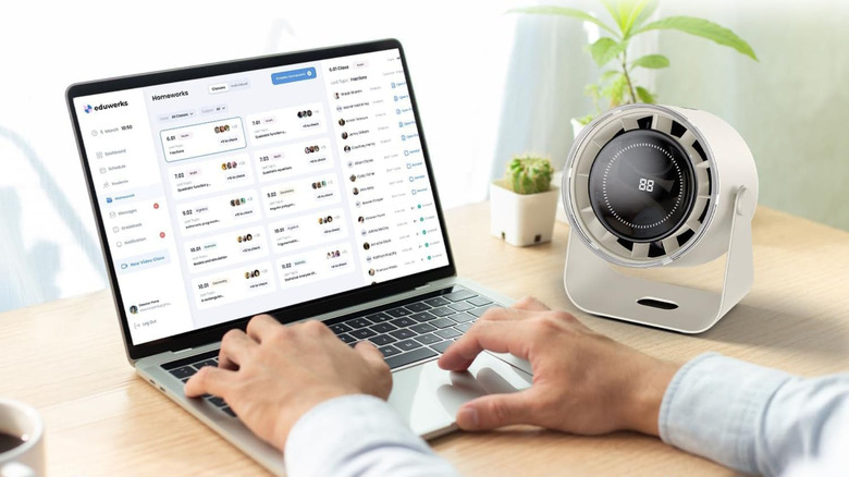 The Durbester desk fan next to a laptop computer