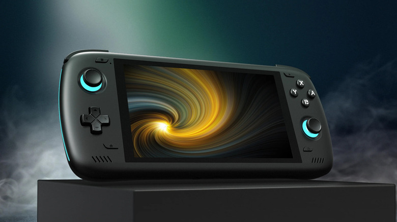 Odin 2 device displayed on a stand, featuring a wide screen with swirling abstract graphics.