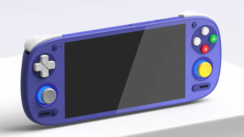 Retroid Pocket 5 shown on a white platform, featuring a blue body with colorful face buttons.