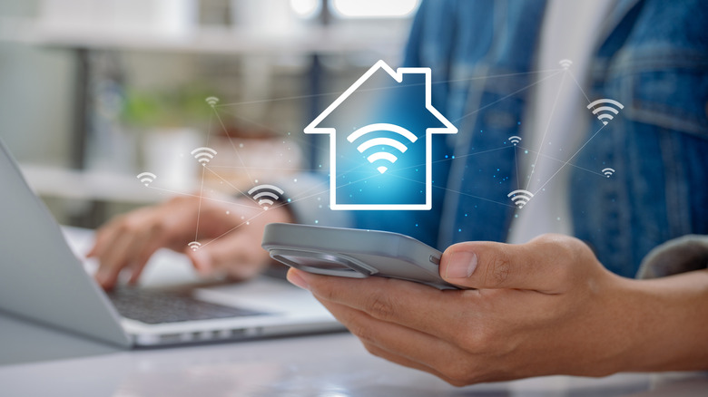 A person setting up a Wi-Fi network at home