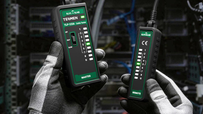 A person using the Tesmen TLP-123A Network Cable Tester