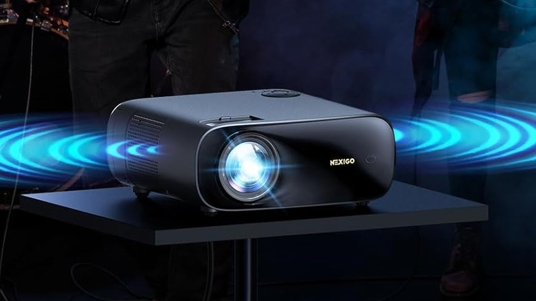 The NexiGo PJ40 (Gen 3) with people's legs in the background.