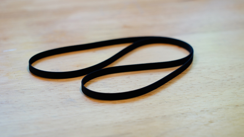 Rubber turntable belt on wood table