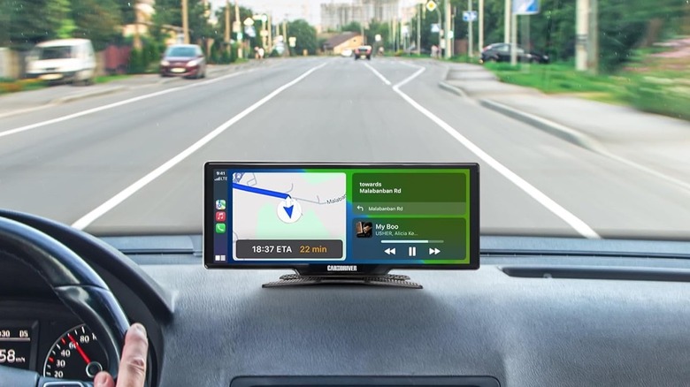 Car & Driver IntelliDash Pro X10 on vehicle dashboard with Apple CarPlay on screen.