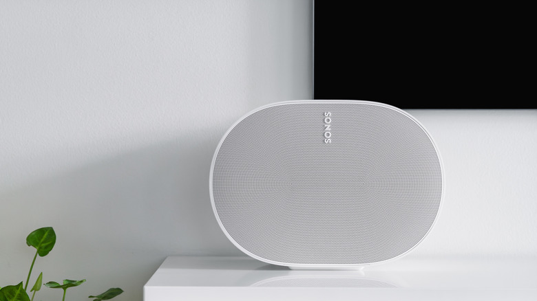 Bluetooth speaker placed underneath a TV