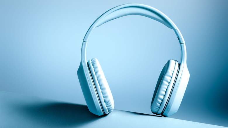 Generic wireless headphones on a blue background.