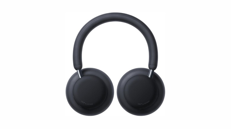 The CMF Headphone Pro in black, with a label detailing CMF by NOTHING on each ear