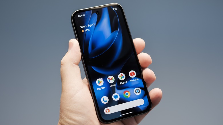 A person holding the Google Pixel 9a