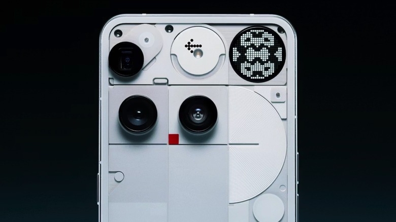 Closeup of the Nothing Phone 3's rear panel, showing the unusual camera placement, the Glyph Matrix, and the transparent elements.