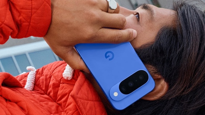 Close-up of a person talking on a Google Pixel 10