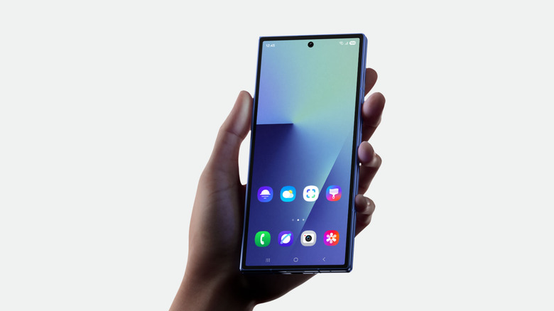 A hand holding the Samsung Galaxy Z Fold 7 against a white background