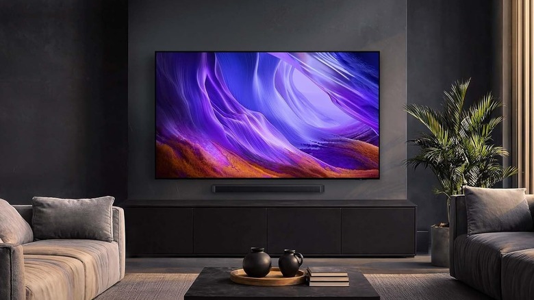 The Samsung S85H mounted on a wall in a living room setup