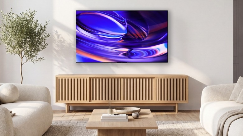 Sony Bravia 6 OLED TV mounted to a wall above a TV unit in a living room