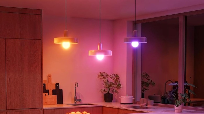 The Govee Smart Light Bulbs being used for low-hanging, kitchen ceiling fixtures. Each bulb is set to a different color.