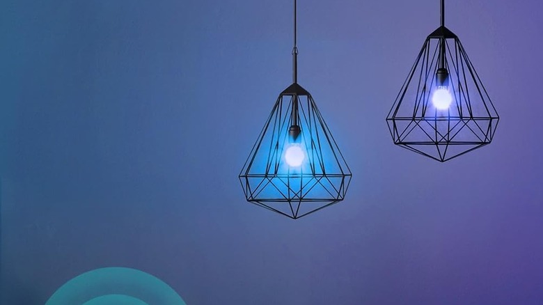 Kasa Smart Light Bulbs being used in low-hanging ceiling fixtures. The bulbs are set to different colors.