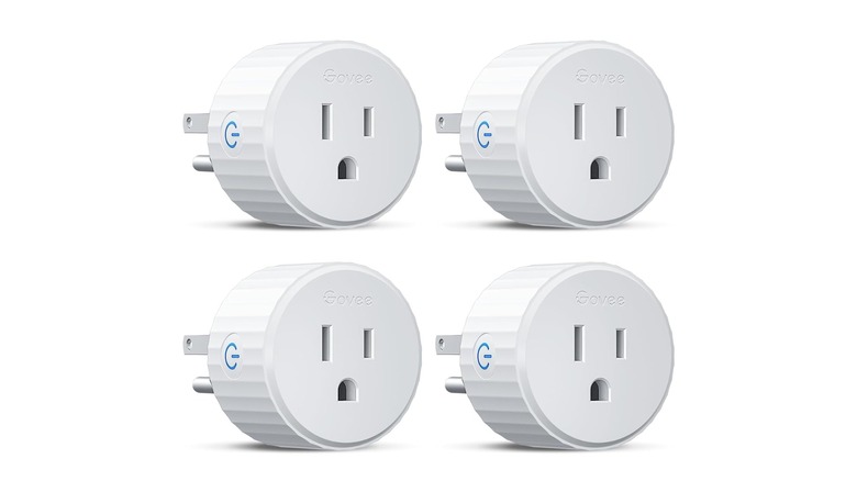 Close-up of four Govee smart plugs on white background