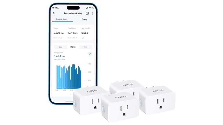 smartphone with Tapo app next to Tapo smart plugs on white background