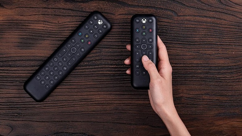 hand holding the 8Bitdo Media Remote for Xbox