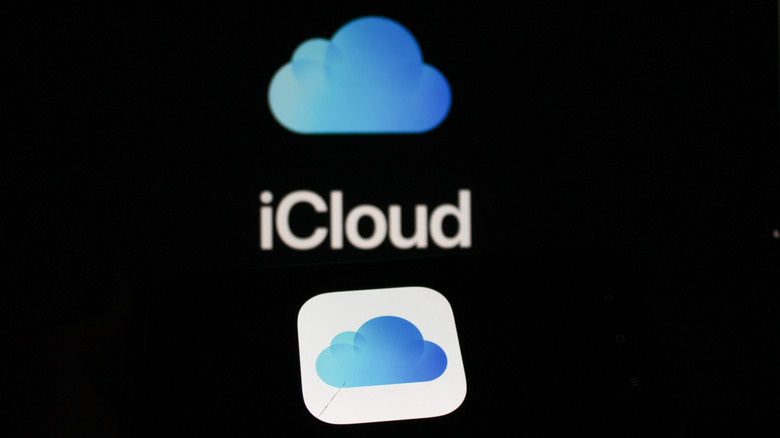 The Apple iCloud logo and icon is displayed on a screen.