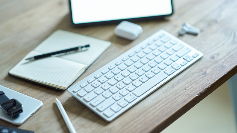 A wireless keyboard on a table.