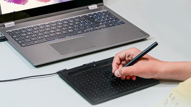 Person using the Wacom Intuos Drawing Tablet