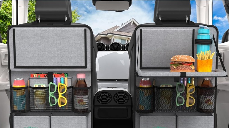 Two Plzpik Car Backseat Organizer attached to the back seats of a vehicle, each organizer has various items to show its organization capabilities