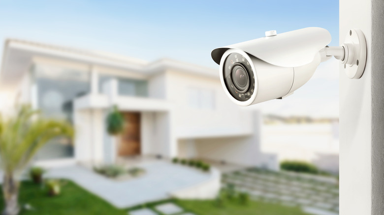 A surveillance camera in front of a house.