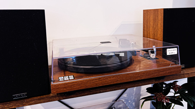 A turntable flanked by two speakers.