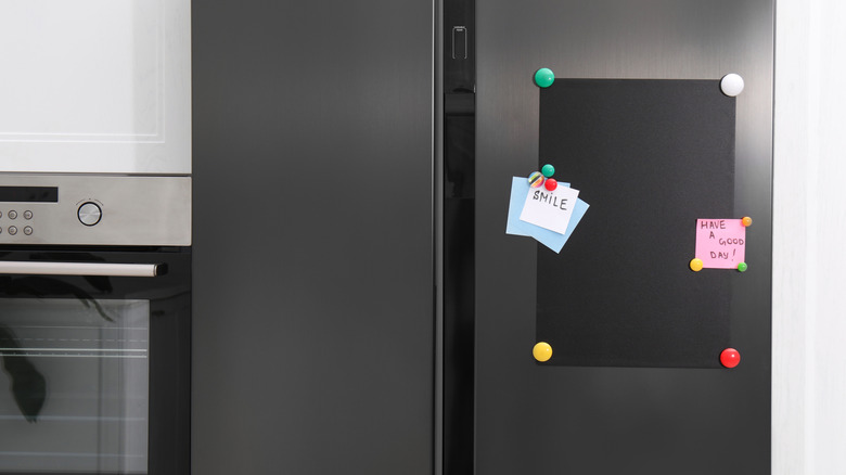 Fridge with notes and message board