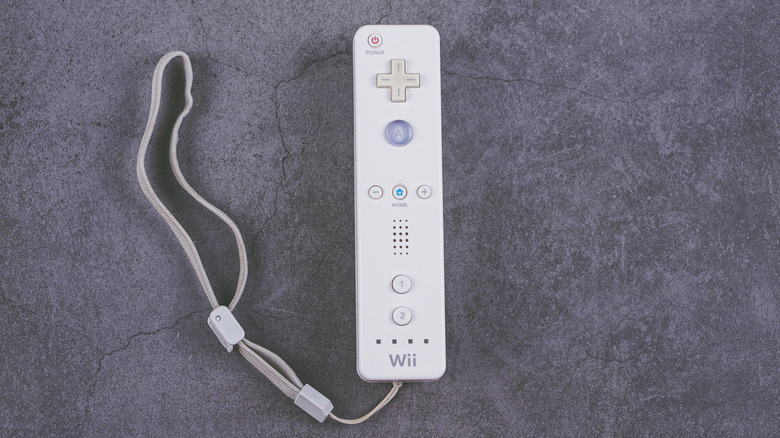 Nintendo Wii Remote on gray stone background