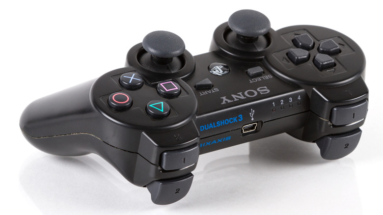 PlayStation 3 controller on a white surface