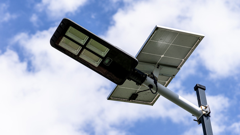 A solar panel powering an LED light.