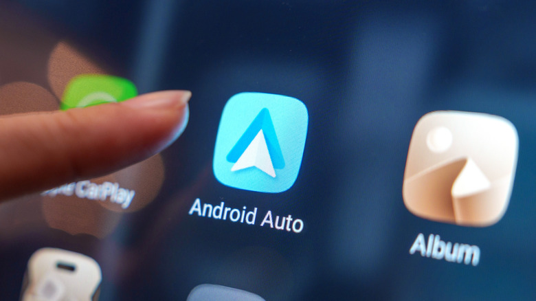 Android Auto icon about to be touched on a car display screen