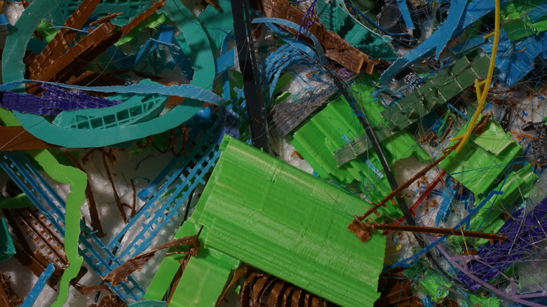 A pile of failed 3D prints and sipports