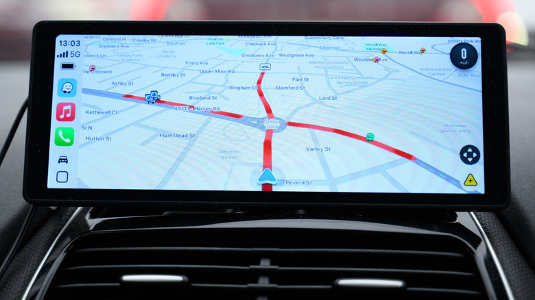 car with Apple CarPlay running the waze app for directions