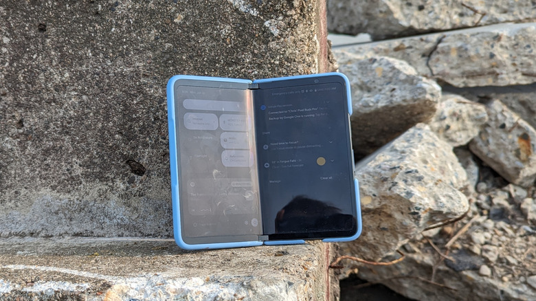 Foldable phone placed on rocks