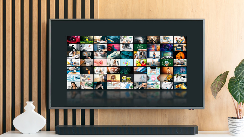 a tv with a soundbar placed below it