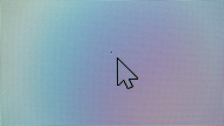 A mouse pointer pointing at a dead pixel.